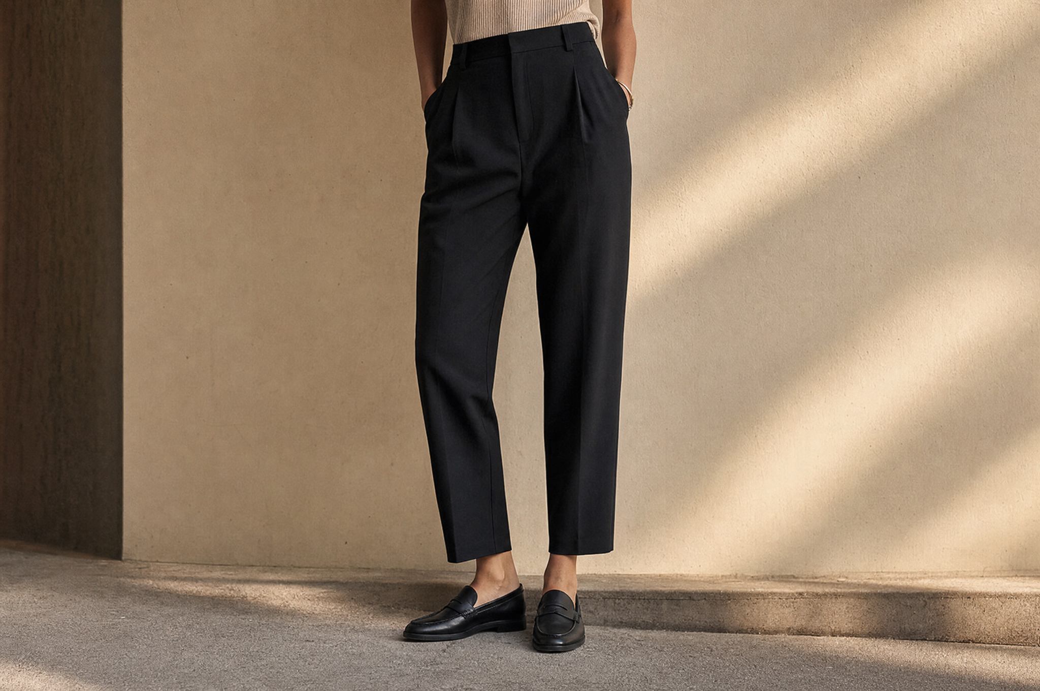 Trousers showing the break at the ankle with leather loafers